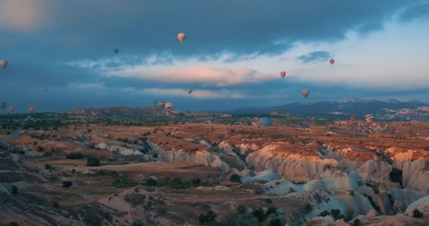 4K Aeriel view of Goreme. Colorful hot air balloons flying over the valleys on July 2016, Famous city Cappadocia, Turkey.