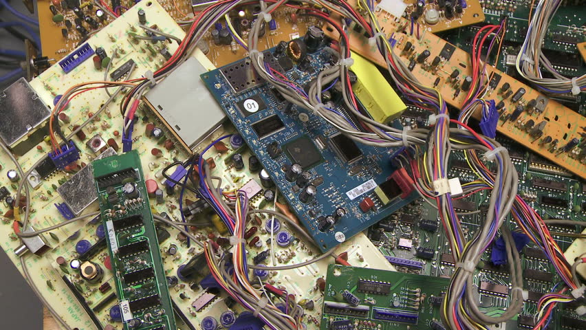 Dolly shot of electronic parts for recycling
