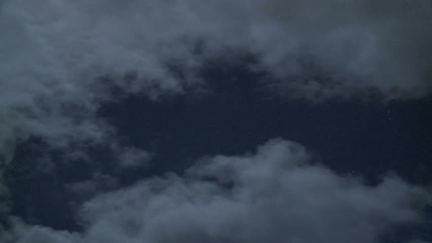 Time lapse of moonlit clouds
