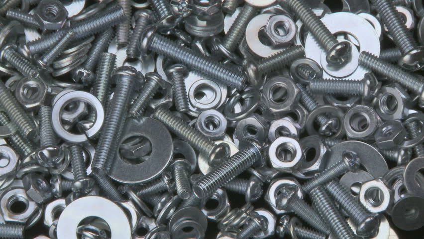 Clockwise rotation of a pile of nuts, bolts and washers