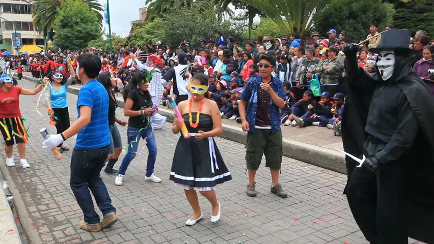 PILLARO, ECUADOR - JANUARY 6: Persons disguised as devils dance in the streets