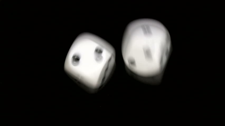 Rolling dice in slow motion, with numbers one and two