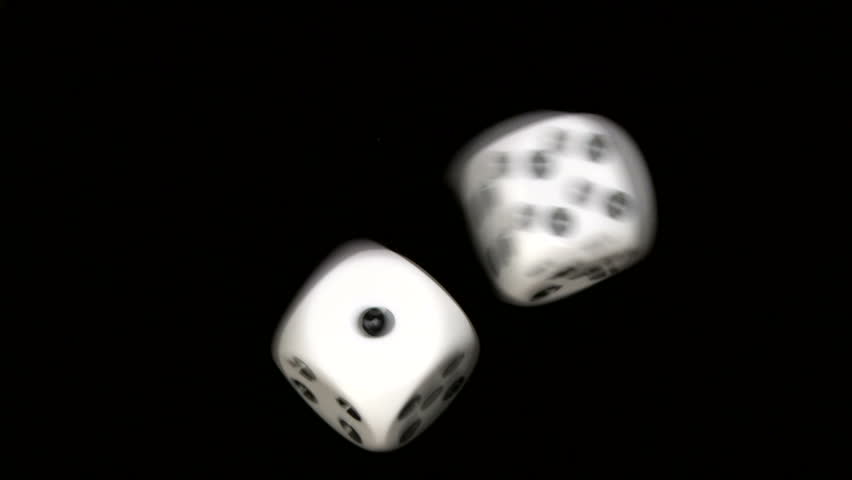 Rolling dice in slow motion, with numbers one and four