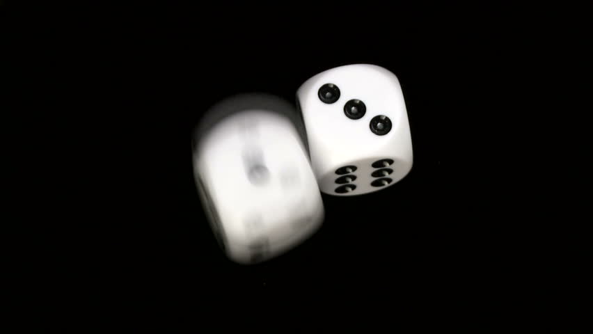 Rolling dice in slow motion, with numbers one and three
