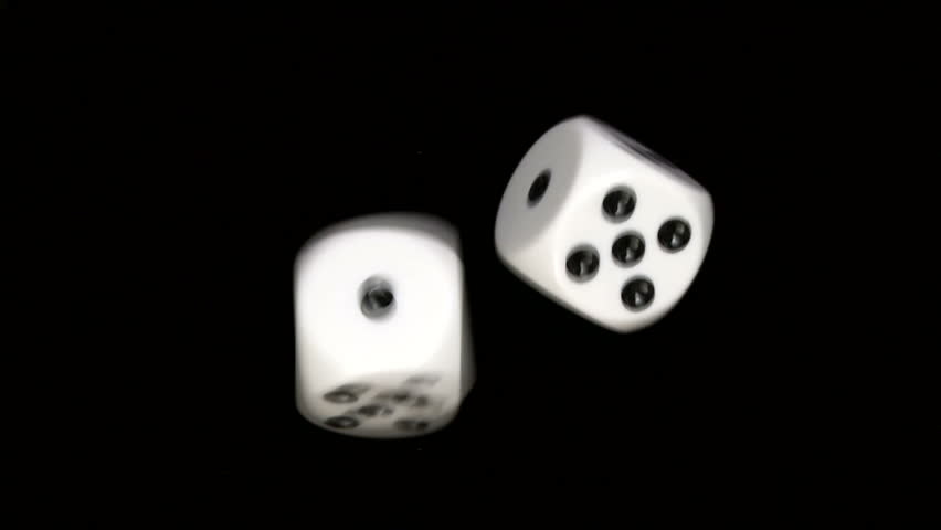Rolling dice in slow motion, with numbers one and five