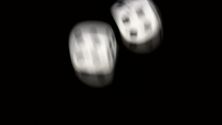 Rolling dice in slow motion, with numbers one and six