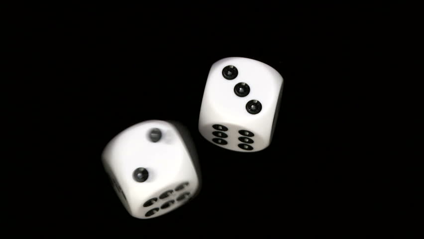 Rolling dice in slow motion, with numbers two and three