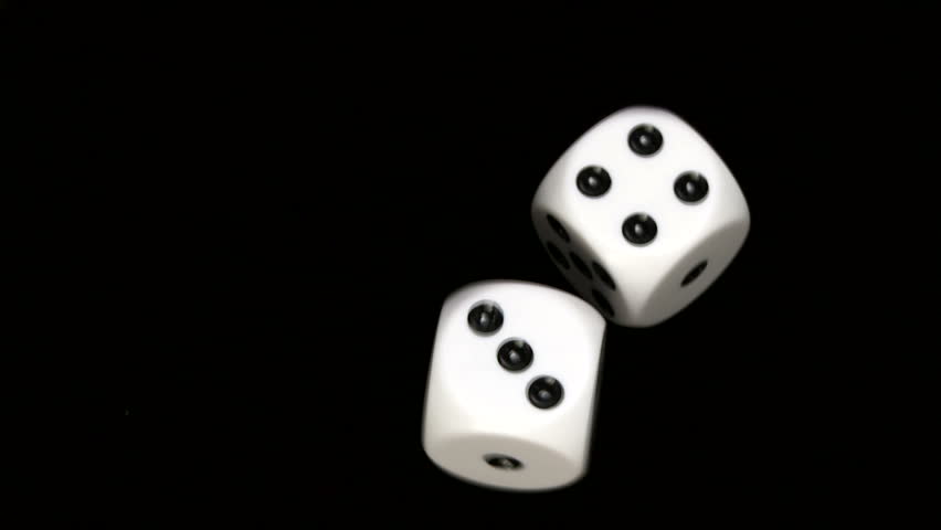 Rolling dice in slow motion, with numbers three and four