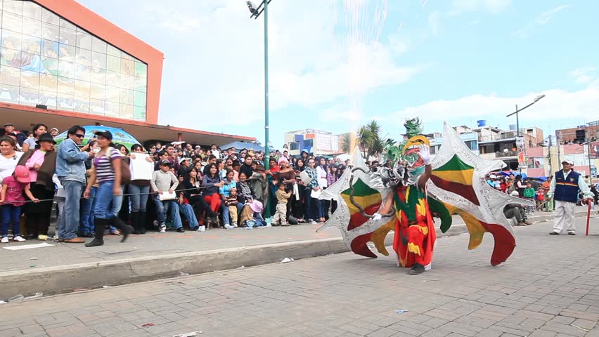 PILLARO, ECUADOR - JANUARY 6: Persons disguised as devils dance in the streets