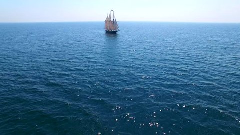 Tall ship at sea, majestic vessel sailing in open waters.
