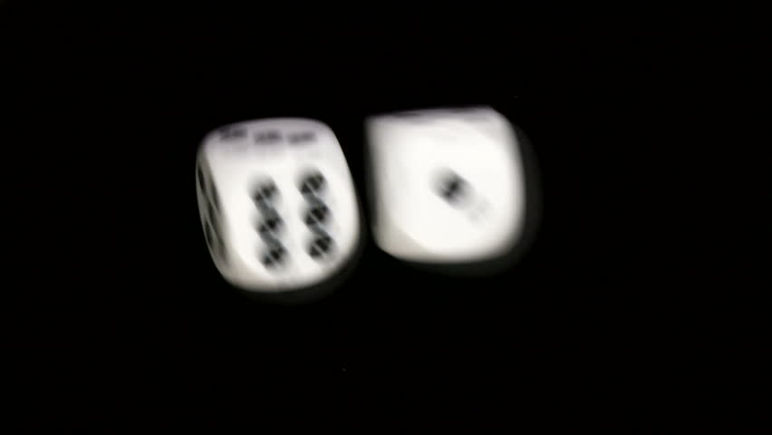 Rolling dice in slow motion with numbers three and five