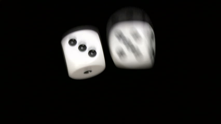 Rolling dice in slow motion with numbers three and six