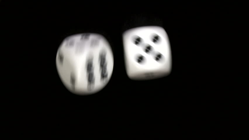 Rolling dice in slow motion with numbers four and five