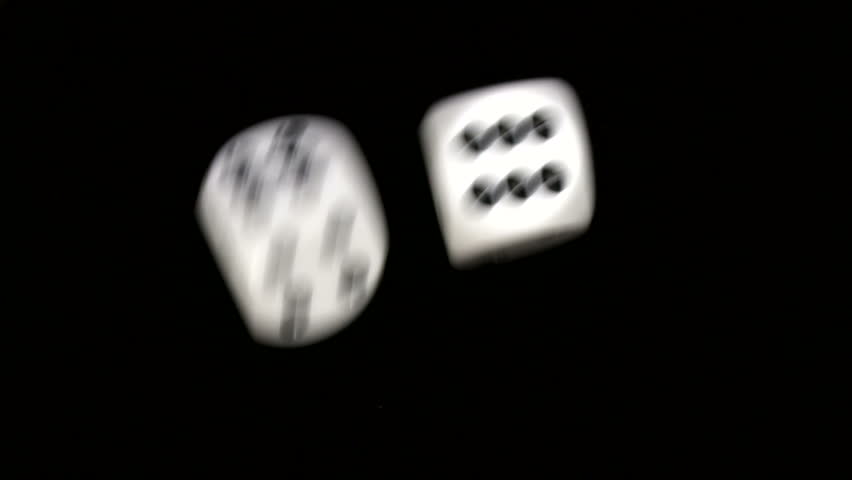 Rolling dice in slow motion with numbers six and six