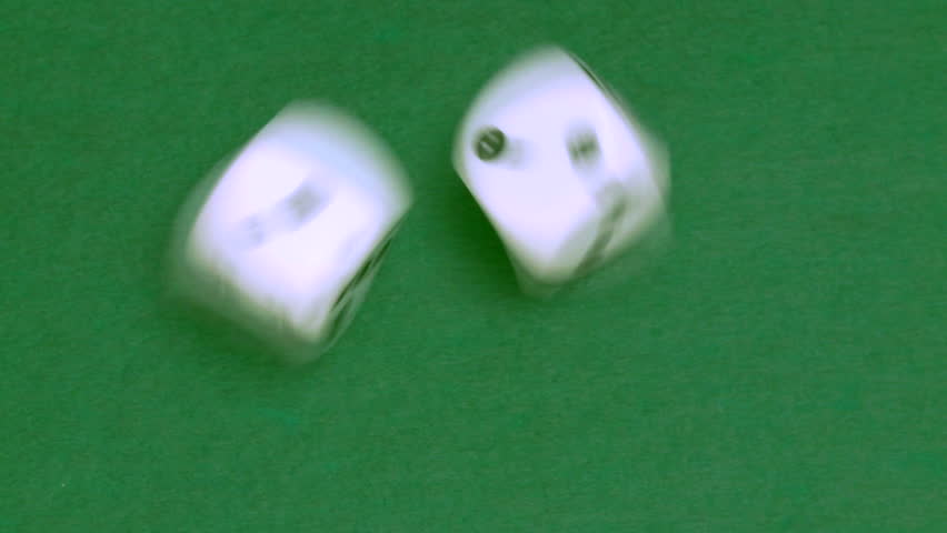 Rolling dice in slow motion with numbers one and two