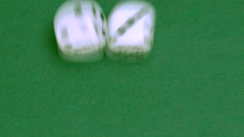 Rolling dice in slow motion with numbers one and three