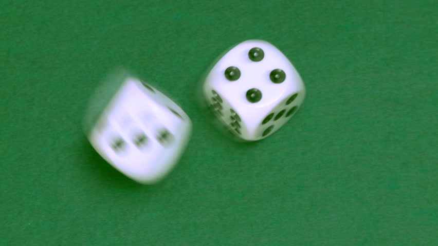 Rolling dice in slow motion with numbers one and four