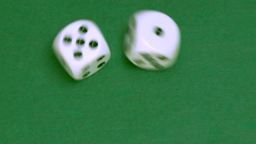 Rolling dice in slow motion with numbers one and five