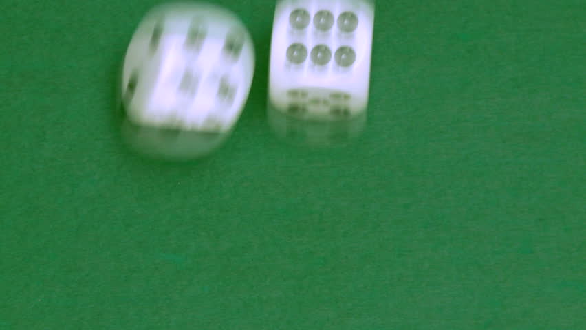Rolling dice in slow motion with numbers one and six