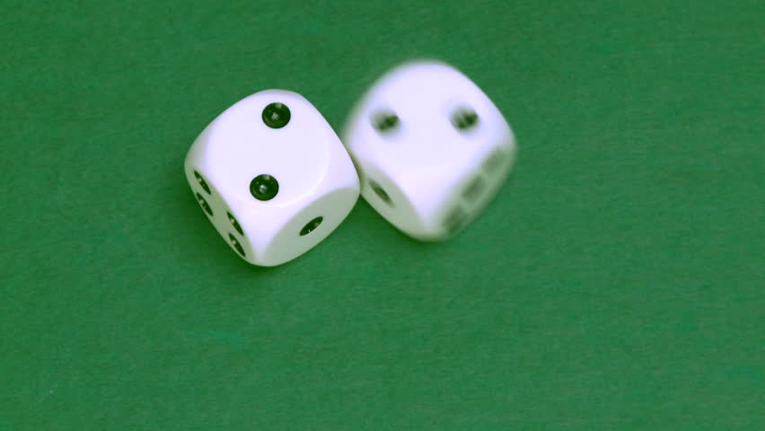Rolling dice in slow motion with numbers two and two