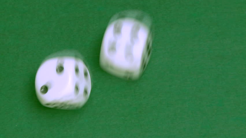 Rolling dice in slow motion with numbers two and four