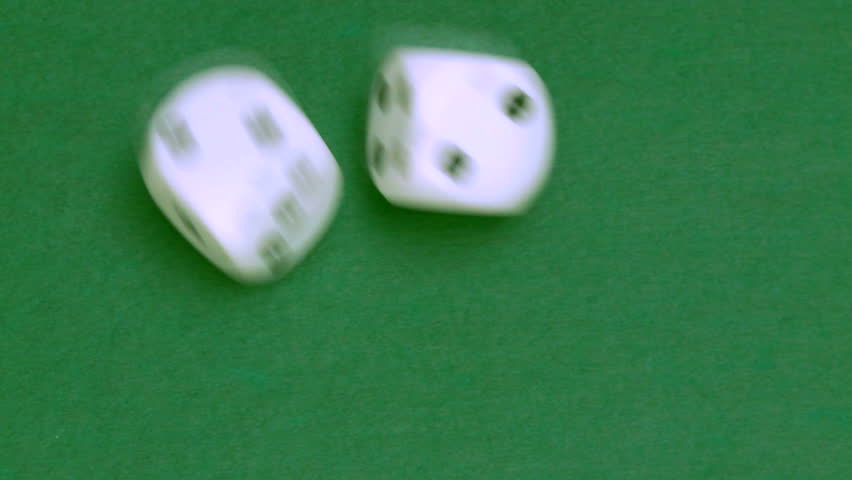Rolling dice in slow motion with numbers two and six