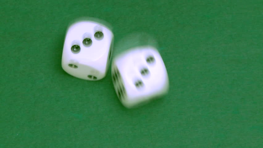 Rolling dice in slow motion with numbers three and three