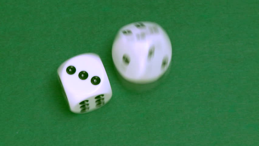 Rolling dice in slow motion with numbers three and four