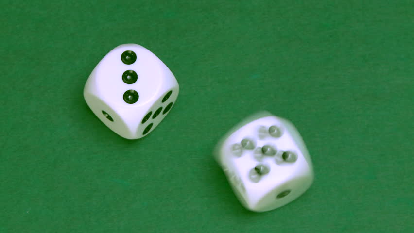 Rolling dice in slow motion with numbers three and five