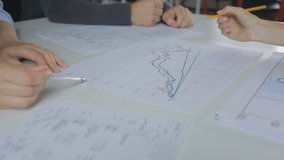 There is close-up image of people discussing graphics - Powered by Shutterstock - Get 15% off with code: PIKWIZARD15