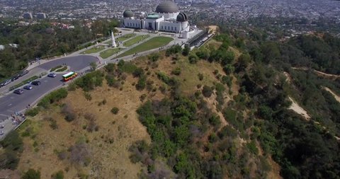 Observatory Park Los Angeles / Multiple aerial clips of flying over Griffith Observatory with people underneath and the downtown Los Angeles skyline.