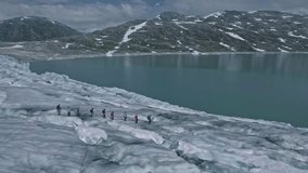 Amazing aerial view on scenic Jostedalsbreen glacier with group of climbers on it, Norway