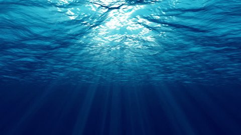 Underwater ocean waves ripple and flow with light rays. 4K seamless loop