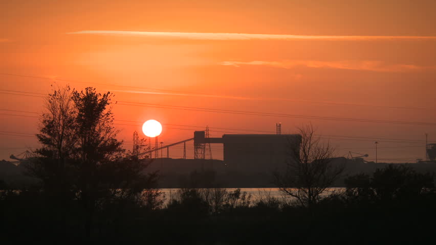 Steel works, Port Talbot, Wales with time lapse setting sun