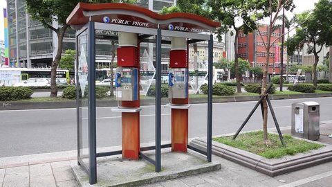 TAIPEI, TAIWAN - MAY 10, 2016: Public telephone booth on sidedwalk Ximendind Taipei, Taiwan.