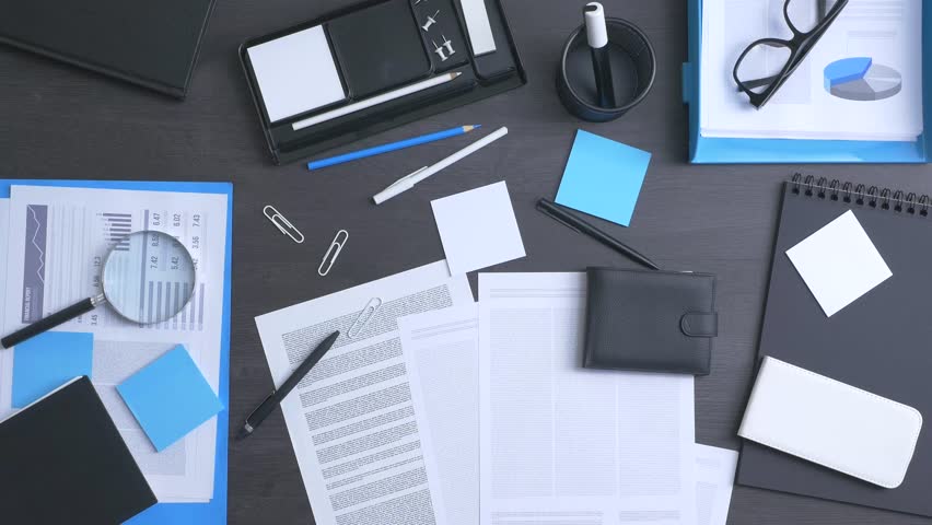 Corporate businessman tidying up his messy desktop, efficiency and organization concept, top view Royalty-Free Stock Footage #18642713