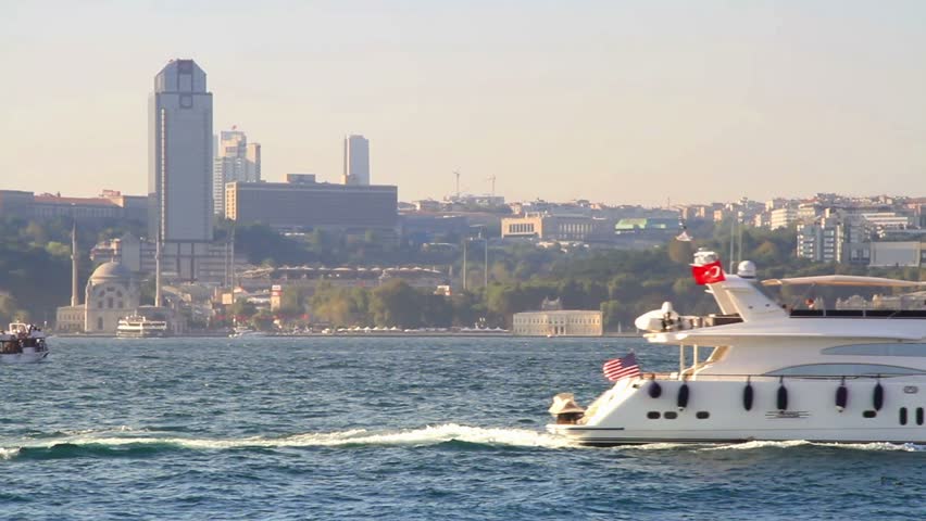 Luxury white yacht sails in Bosporus waters 