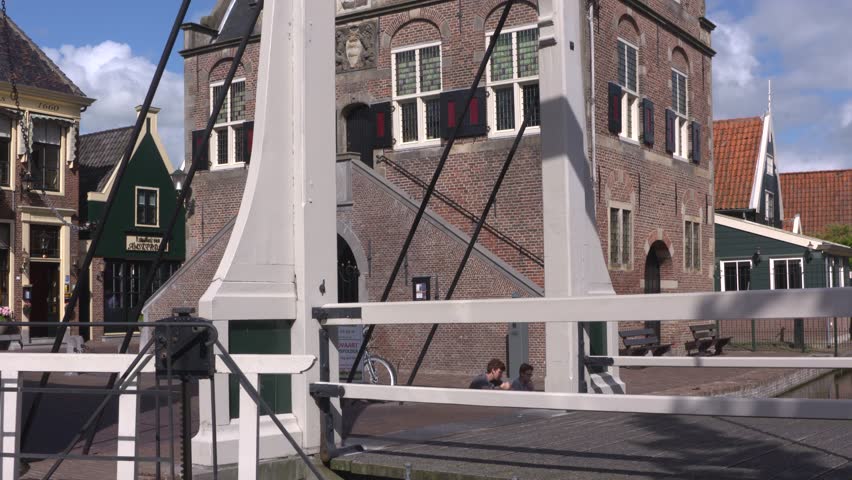 GRAFT-DE RIJP, THE NETHERLANDS - August 2016: tilt up facade of the Leeghwater-designed Town Hall and Weigh house anno 1630 behind the drawbridge in the center of a 17th century village