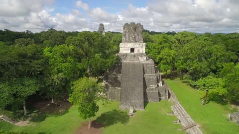 Spectacular aerial shot over the Tikal pyramids in Guatemala. (Guatemala 2010s)