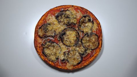top view of baked pizza with eggplant and mushrooms