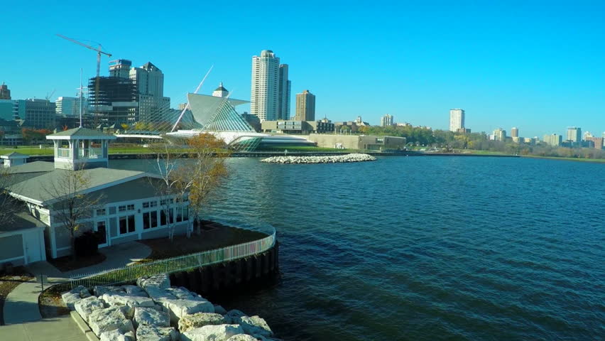 A good aerial shot over the Milwaukee Wisconsin waterfront reveals the art museum. (Milwaukee, Wisconsin 2010s)