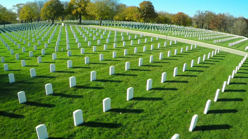 An aerial over a vast cemetery of headstones honors America's veterans. (USA 2010s) Royalty-Free Stock Footage #18664121