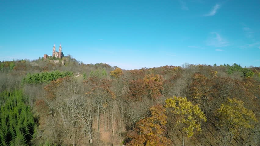 A nice aerial above the treetops reveals the Holy Hill Christian monastery in rural Wisconsin. (Wisconsin 2010s)