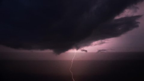 Lightning flashes in a sky during a strong thunderstorm