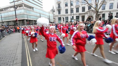 LONDON, UK - JANUARY 1: Cheerleaders shout 'Happy New Year' in the London Parade on January 1, 2012 in London, UK.  London Parade is held every year on January 1.