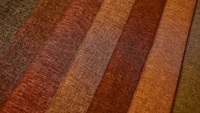 Upholstery textile materials variety shades of brown and orange footage