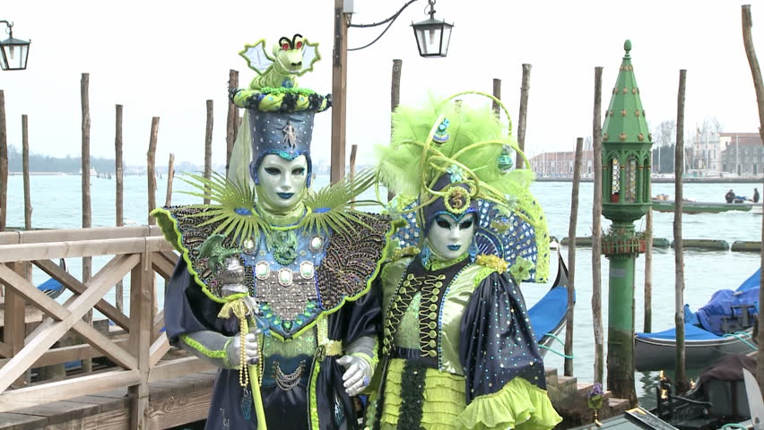 VENICE, ITALY - FEBRUARY 24 2009 Masked couple dressed as a king  during