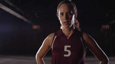 Slow-Motion  --  Female Volleyball Player --  Looks at camera intensely 