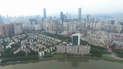A skyline aerial view of Shenzhen, China under smokey weather
