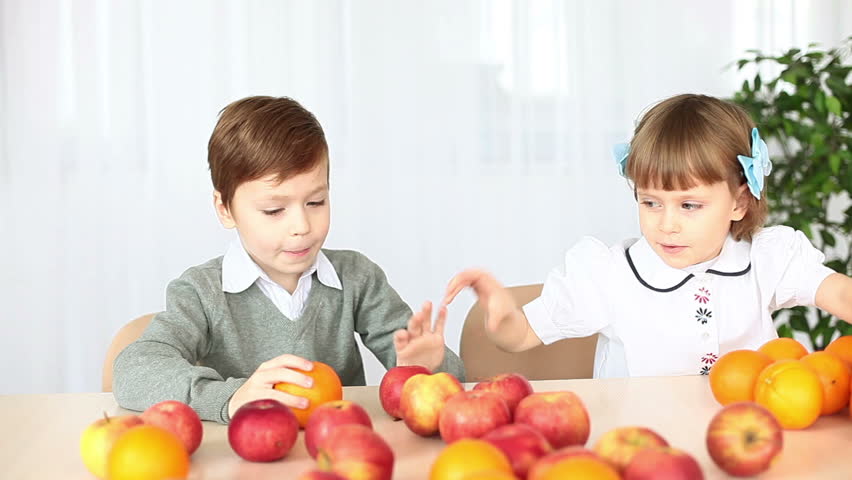 Children playing with fruit